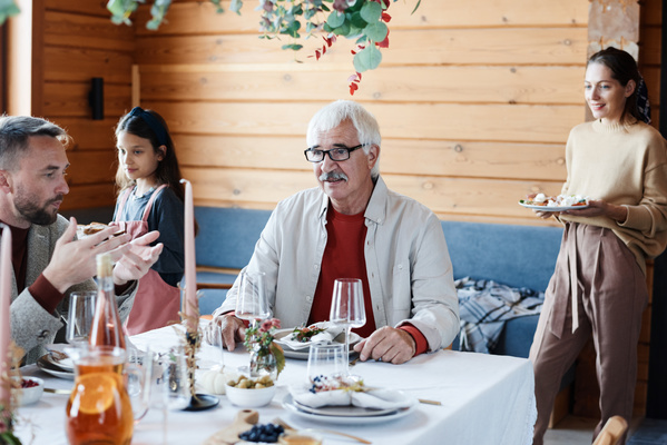 Grandpa is Sitting at Festive Table